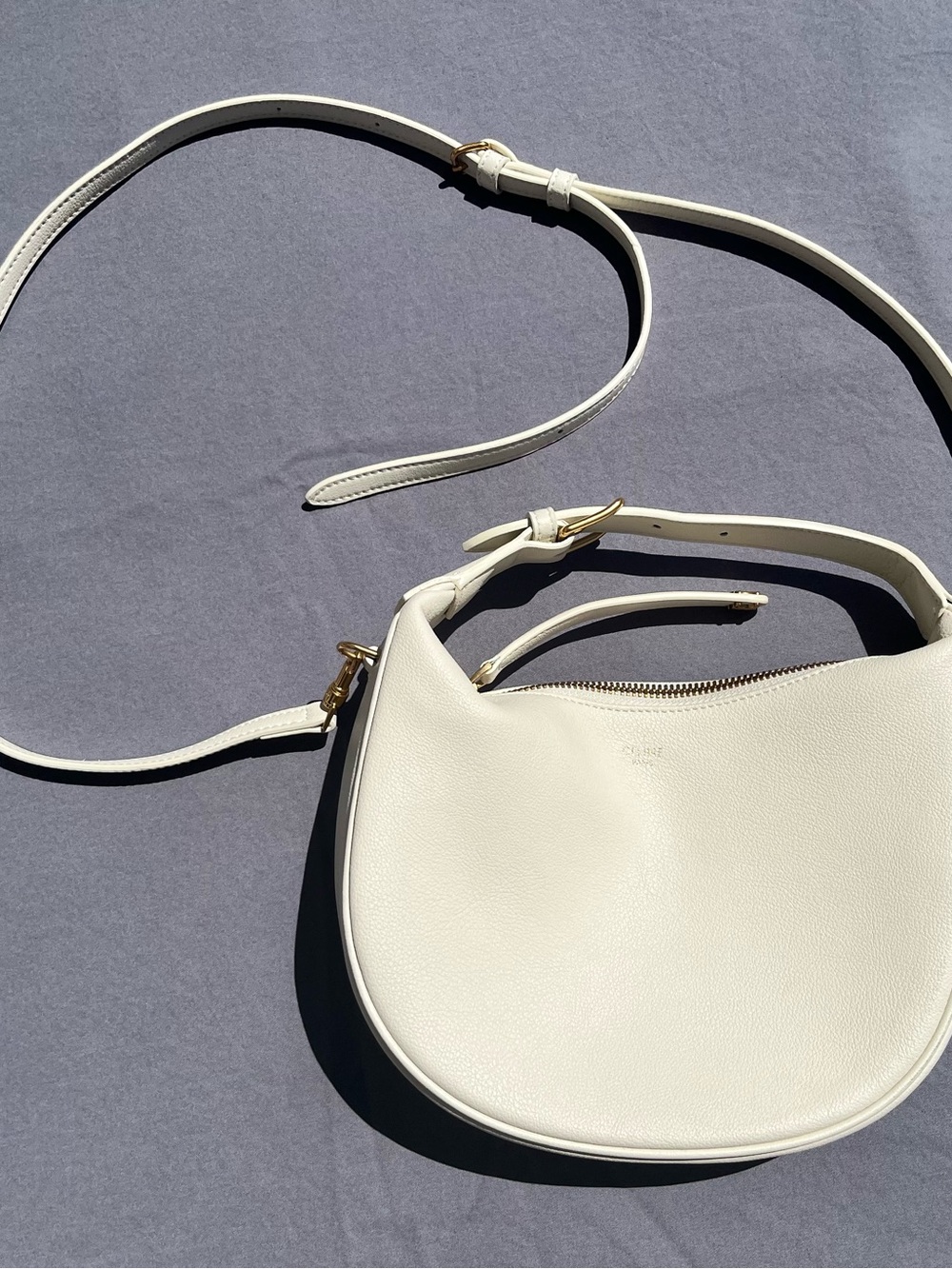 CELINE Paris Curved Leather Shoulder Bag in Cream with Gold Accents